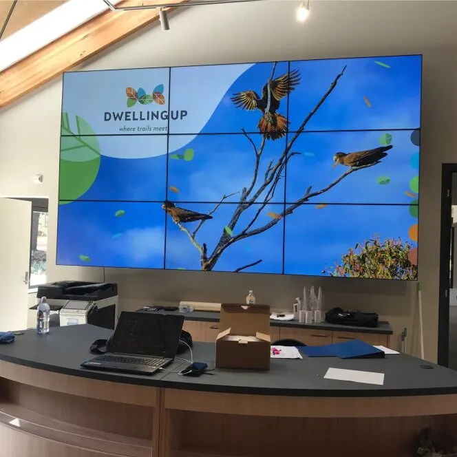Dwellingup video wall behind a sales desk