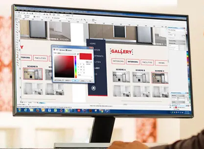 A monitor showing a gallery screen layout being edited with a colour picker