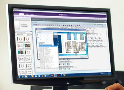 A monitor showing content design software with a floor plan layout